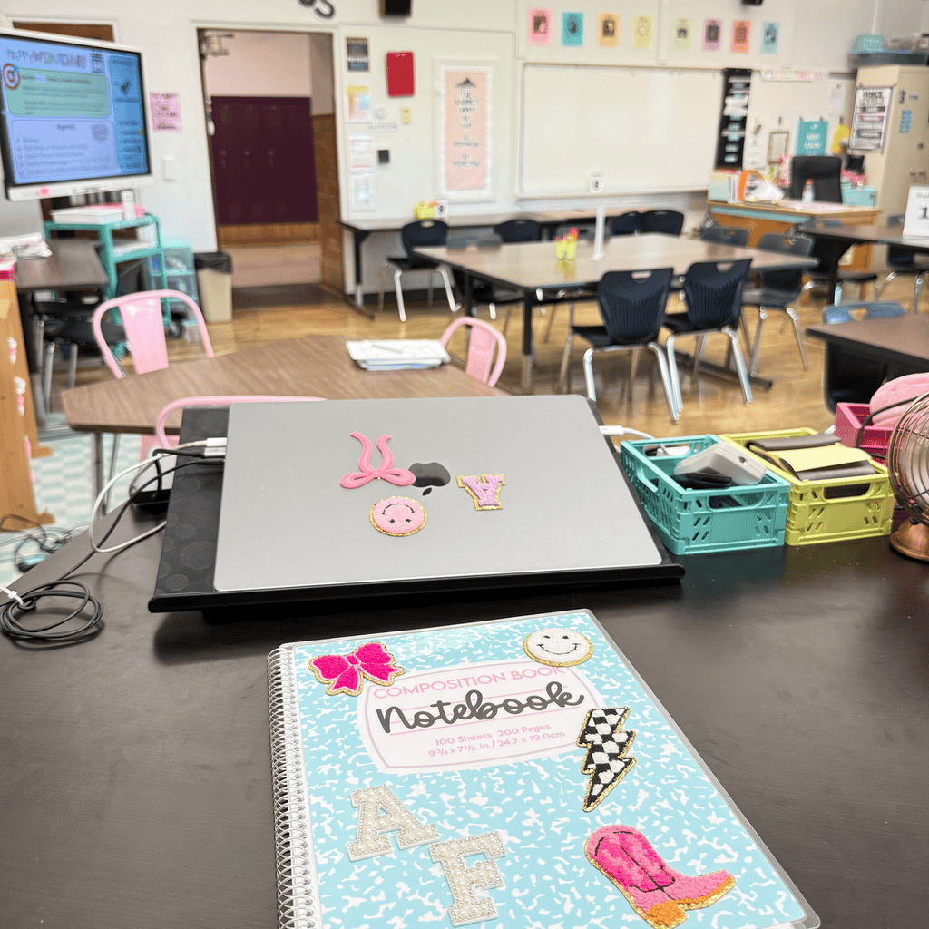 personalized notebook on teacher desk